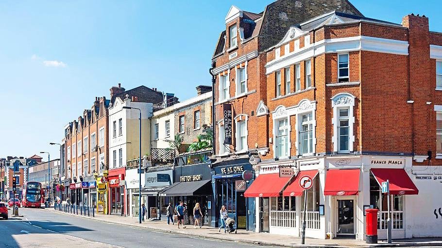 Putney High Street showing the vibrant local area served by our chartered surveyors